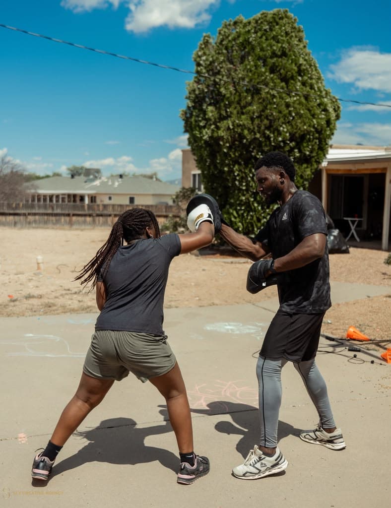 Boxing pad work training session