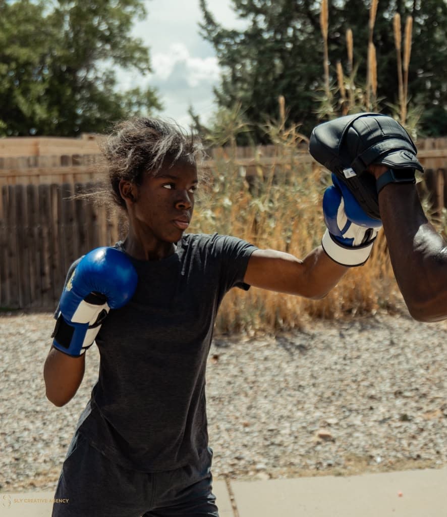 Athlete punching a focus mitt